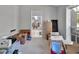Spare bedroom with view into living area and currently used for storage at 1450 Alden St, Deland, FL 32720