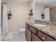 Bathroom with granite countertop, shower, and toilet at 1660 Trinidad St, Deland, FL 32720