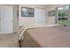 Bedroom with queen-size bed and double door closet at 1660 Trinidad St, Deland, FL 32720