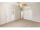 Bright bedroom with carpet, double doors to closet, and access to bathroom at 19 Cambridge Trce, Ormond Beach, FL 32174