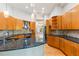 Large kitchen with curved island and stainless steel appliances at 19 Cambridge Trce, Ormond Beach, FL 32174