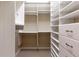 Spacious walk-in closet with custom built-in shelving at 19 Cambridge Trce, Ormond Beach, FL 32174