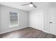 Simple bedroom with double door closet and wood flooring at 1925 1St Ave, Deland, FL 32724