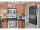 Modern kitchen featuring stainless steel appliances and dark countertops at 19343 Moorgate St, Orlando, FL 32833