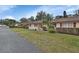 Side view of house and landscaping, showing street at 2 Villa Villar Ct # 02, Deland, FL 32724