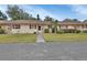 Front view of house, showing landscaping and driveway at 2 Villa Villar Ct # 02, Deland, FL 32724