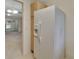 White refrigerator in kitchen with light wood cabinets at 2 Villa Villar Ct # 02, Deland, FL 32724