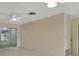 Living room with sliding doors leading to sunroom at 2 Villa Villar Ct # 02, Deland, FL 32724