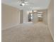 Large living room with carpet and view of kitchen at 2 Villa Villar Ct # 02, Deland, FL 32724