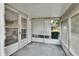 Screened porch with exterior door access and view of backyard at 2 Villa Villar Ct # 02, Deland, FL 32724