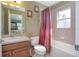Clean bathroom with tub, toilet, and vanity at 204 Wellington Woods Ave, Deland, FL 32724