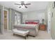 Bright bedroom with a king-size bed, large windows, and an ensuite bathroom at 204 Wellington Woods Ave, Deland, FL 32724