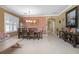 Spacious dining room with a large wooden table and neutral color scheme at 204 Wellington Woods Ave, Deland, FL 32724