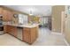 Modern kitchen with stainless steel appliances and light wood cabinets at 204 Wellington Woods Ave, Deland, FL 32724