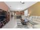 Spacious living room featuring a comfortable seating area and views into the kitchen at 204 Wellington Woods Ave, Deland, FL 32724