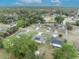 Aerial view of a residential neighborhood showcasing multiple houses and lush green trees at 216 Hickory Ave, Orange City, FL 32763