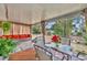 Relaxing covered patio with seating area and string lights at 216 Hickory Ave, Orange City, FL 32763
