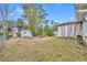 Large backyard with shed and mature trees at 216 Hickory Ave, Orange City, FL 32763