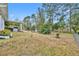 Large backyard with mature trees and grassy area at 216 Hickory Ave, Orange City, FL 32763