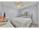 Guest bedroom with large bed and ceiling fan at 216 Hickory Ave, Orange City, FL 32763