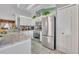 Modern kitchen features stainless steel appliances and ample counter space at 216 Hickory Ave, Orange City, FL 32763