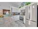 Modern kitchen with stainless steel appliances and granite countertop at 216 Hickory Ave, Orange City, FL 32763