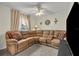 Relaxing living room with sectional sofa and large TV at 216 Hickory Ave, Orange City, FL 32763