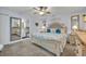 Bright main bedroom with ensuite bathroom access and large mirror at 216 Hickory Ave, Orange City, FL 32763