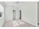 Bright bedroom with ceiling fan and access to hallway and closet at 229 S Adams St, Daytona Beach, FL 32114