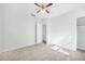 Spacious bedroom featuring a ceiling fan and ample closet space at 229 S Adams St, Daytona Beach, FL 32114