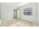 Well-lit bedroom with carpet flooring, window, and closet at 229 S Adams St, Daytona Beach, FL 32114