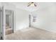 Bedroom with carpet, ceiling fan, and access to hallway and closet at 229 S Adams St, Daytona Beach, FL 32114
