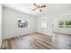Spacious bedroom with wood-look floors and large windows at 229 S Adams St, Daytona Beach, FL 32114