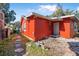 Red brick house exterior with a stone walkway at 229 S Adams St, Daytona Beach, FL 32114