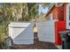 White wooden gate providing backyard access at 229 S Adams St, Daytona Beach, FL 32114