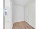 Hallway with white shiplap accent wall and wood-look floors at 229 S Adams St, Daytona Beach, FL 32114