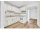 Kitchen with white cabinets, new flooring and appliances at 229 S Adams St, Daytona Beach, FL 32114