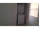 This is a laundry room that features a stacked washer and dryer and a window for added light at 229 S Adams St, Daytona Beach, FL 32114