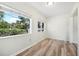 Bright office space with wood-look floors and windows at 229 S Adams St, Daytona Beach, FL 32114