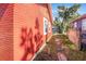Brick side yard with stone pathway at 229 S Adams St, Daytona Beach, FL 32114