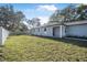 Newly built home with a spacious front yard and a white fence at 2373 Weldon Ct, Deltona, FL 32738