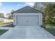 New gray garage door with black accents at 2373 Weldon Ct, Deltona, FL 32738