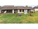 Backyard view showing screened patio and AC units at 245 Terrace Hill Blvd # 1E, Debary, FL 32713
