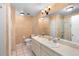 Clean bathroom with double vanity and shower/tub combo at 245 Terrace Hill Blvd # 1E, Debary, FL 32713