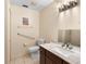 Bathroom with a toilet, vanity with marble top, and grab bar at 245 Terrace Hill Blvd # 1E, Debary, FL 32713
