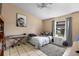 Bedroom with a single bed, keyboard, and a black and white picture of a lion at 245 Terrace Hill Blvd # 1E, Debary, FL 32713