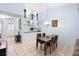Dining area with a chandelier and kitchen pass-through at 245 Terrace Hill Blvd # 1E, Debary, FL 32713