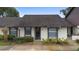 Front view of condo building with landscaping at 245 Terrace Hill Blvd # 1E, Debary, FL 32713
