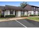 Condo building with parking and manicured lawn at 245 Terrace Hill Blvd # 1E, Debary, FL 32713