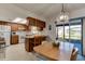 Kitchen with wood cabinets and eat-in dining area at 2608 Treehaven Dr, Deltona, FL 32738